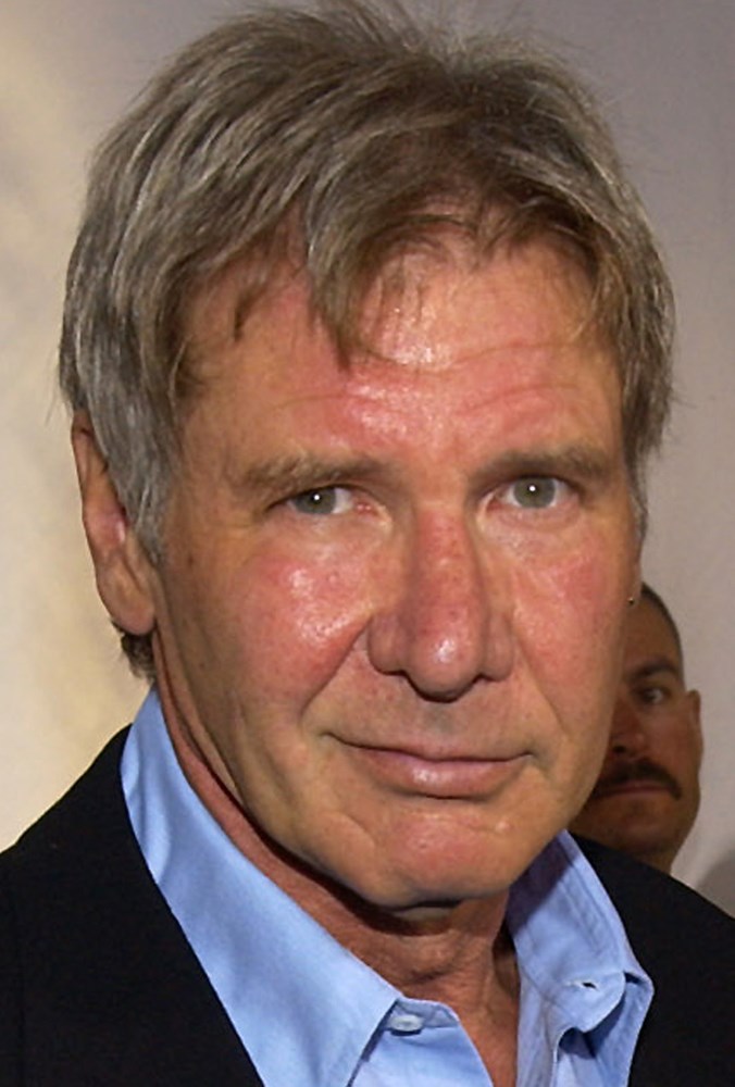 ** FILE ** Harrison Ford arrives for a fashion show in this Tuesday, Sept. 9, 2003 file photo, in the Beverly Hills section of Los Angeles. Ford will stay on as chairman of an Experimental Aircraft Association program that introduces children to flying, he announced during the EAA's 53rd annual AirVenture fly-in and convention in Oshkosh, which ended Sunday, July 31, 2005. (AP Photo/Chris Weeks)