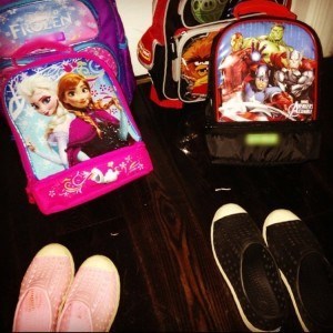बैग and school shoes near door