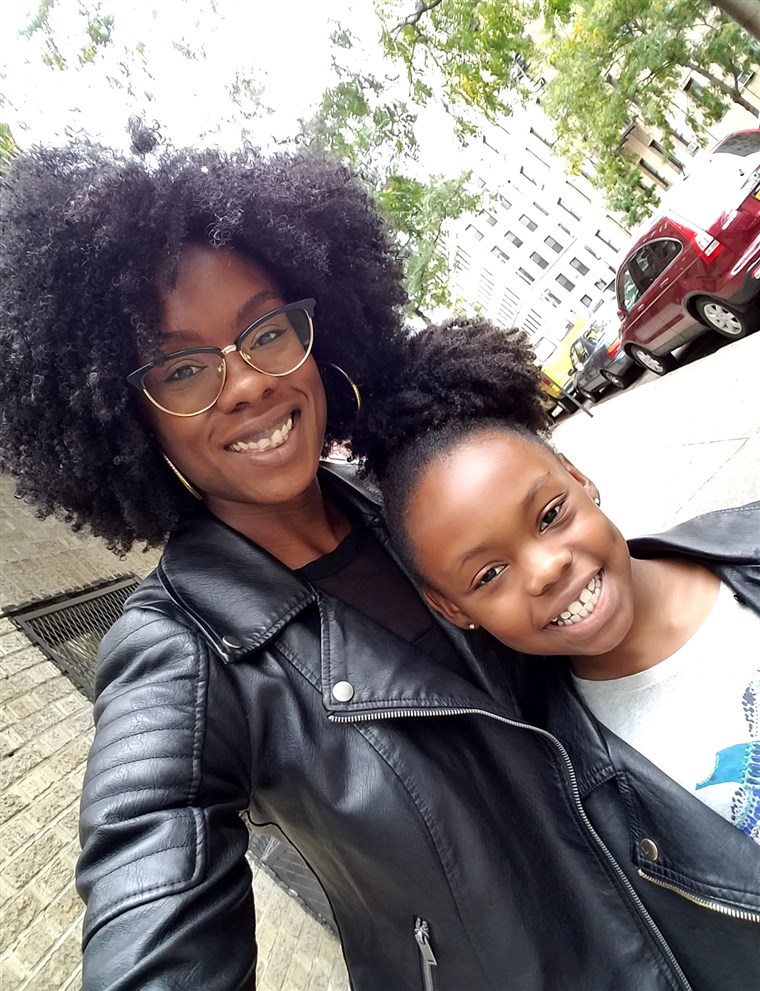 Károly poses with her daughter, who now loves to wear her hair curly just like her mom. 
