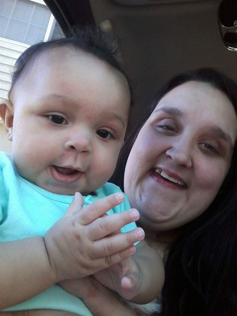 א photo of Hannah Simmons holding her infant daughter, A'lannah