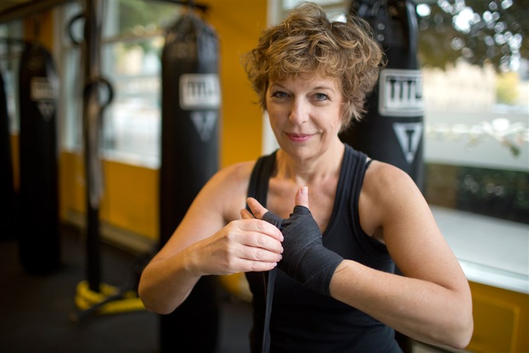 דיאן Mapes, seen here wrapping her hands before working out at Axtion Club boxing gym in downtown Seattle, ...
