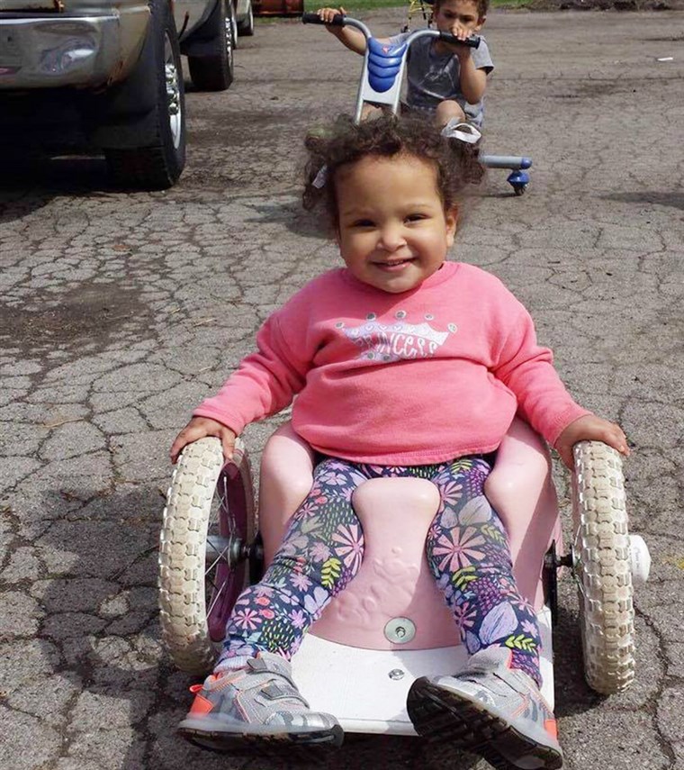 Hvala to a Bumbo-seat wheelchair, Bella Shorr can chase her brother and sister around outside.