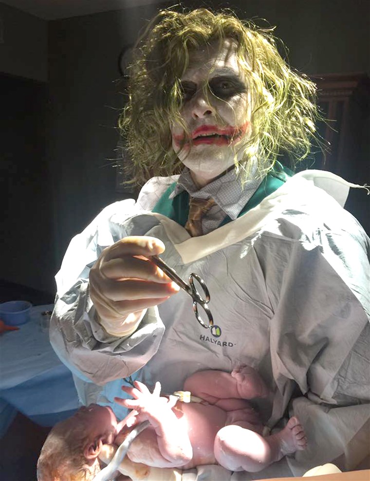 Dr. Paul Locus of the Henry County Medical Center in Paris, Tennessee delivers Oaklyn Selph on Halloween while wearing a Joker costume at the parent's request.