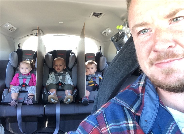 גד goes viral after creating divider walls between his triplets' car seats to keep them from fighting.