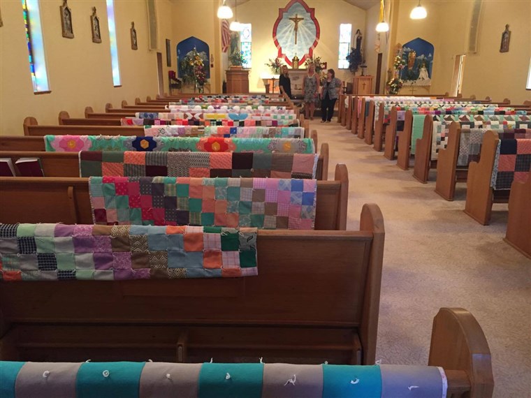 मार्गरेट Hubl's quilts were draped over each pew at her church to honor her memory.