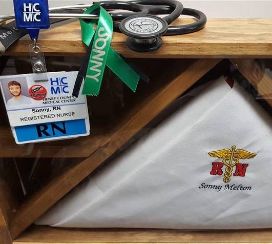 סאני's personal items, including his identification badge for the hospital where he worked as a nurse.