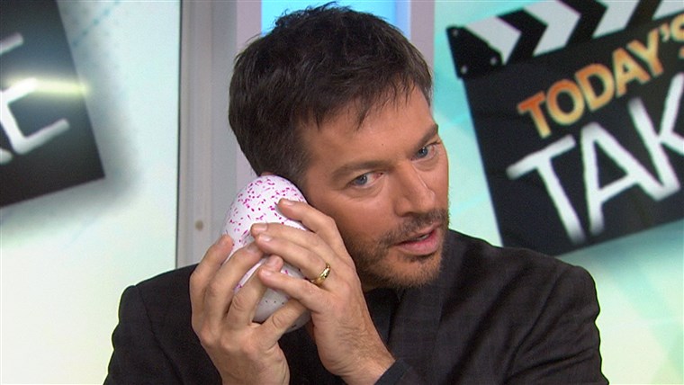 क्या's going on in there? Harry Connick Jr. waits for the Hatchimal egg to crack.