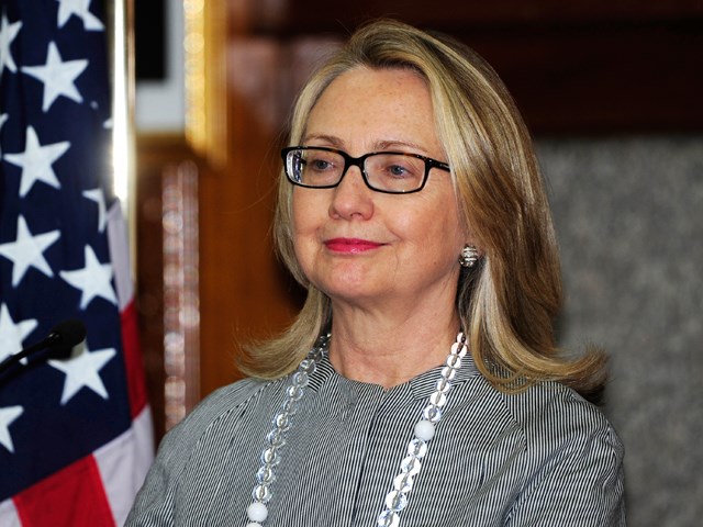 वह looks a bit relieved, no? A makeup-less Hillary Clinton looks on during a press conference in Dhaka on March 5.