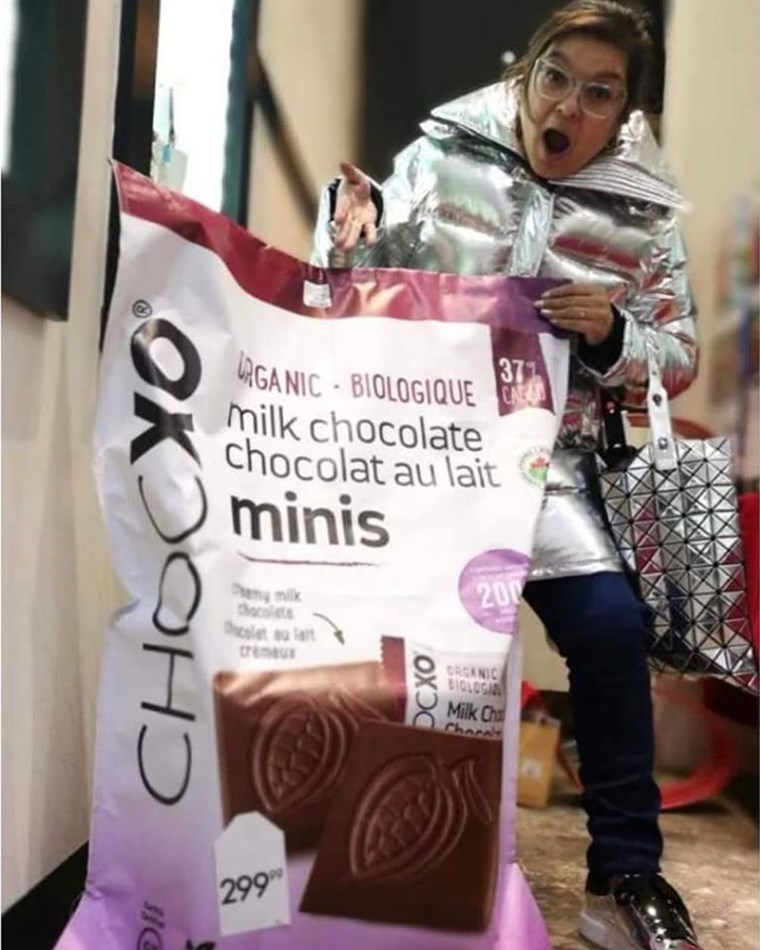 महिला behind a giant bag of ChocXO chocolates