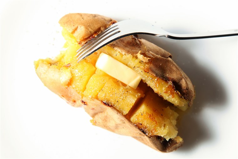 Sült sweet potato, baked sweet potato with butter, whole baked sweet potato