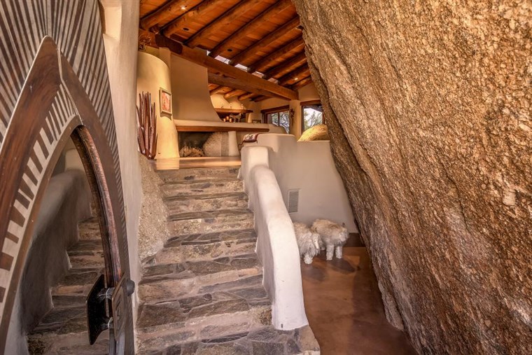 A 'boulder house' contains ancient rock carvings and is for sale