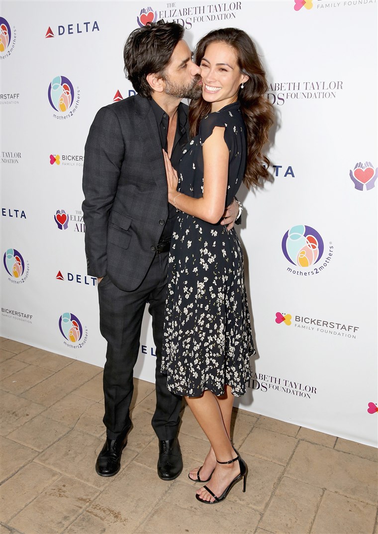 जॉन Stamos and Caitlin McHugh attend The Elizabeth Taylor AIDS Foundation and mothers2mothers dinner in October.