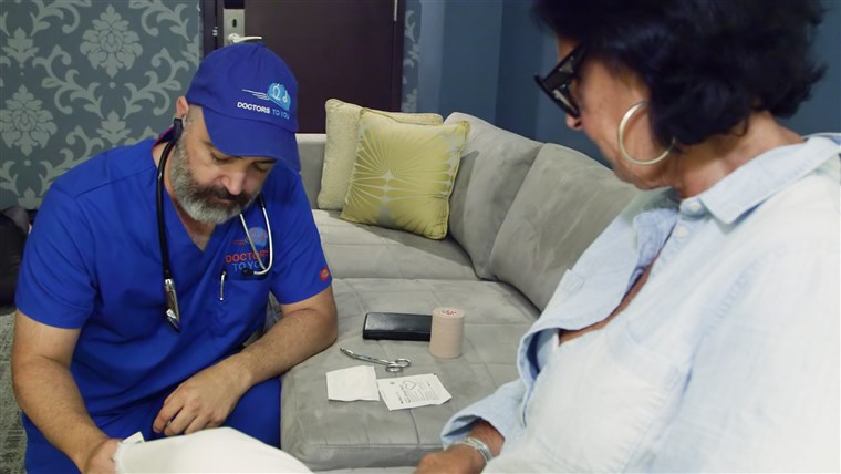 חום with a patient at a D.C. hotel. “I can do more in one house call than I could ever do sitting in a box at a clinic, being told I have to see patients every 10 minutes,