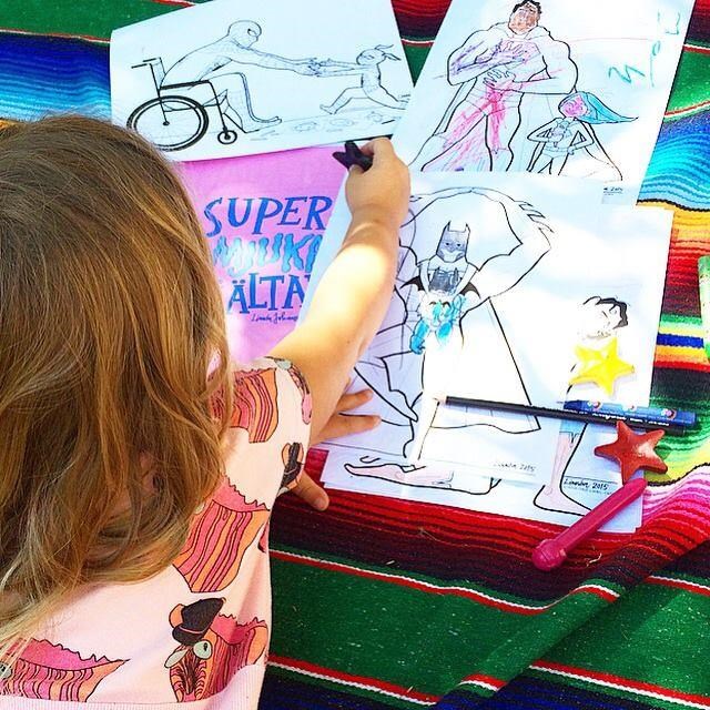 djeca color drawings that show everything from Batman wearing a baby to Spider-Man in a wheelchair.
