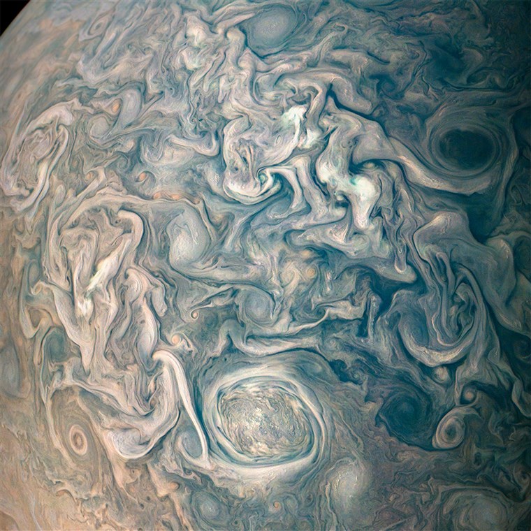 ए new photo from the Juno spacecraft offers a mesmerizing look at the swirling clouds that make up Jupiter's atmosphere.