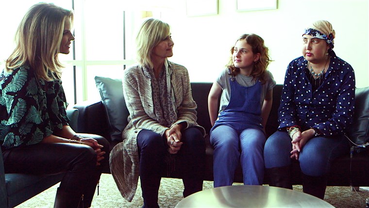 Olivia Newton-John speaks with cancer patients at the research center she founded.