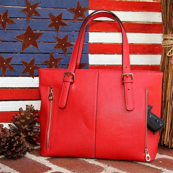 Ez leather tote has a gun compartment equipped with two zippers for left-handed or right-handed shooters