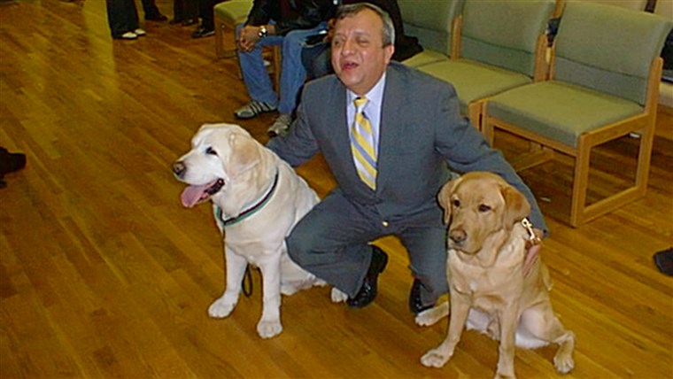 עומר Rivera with guide dogs Salty and Montana