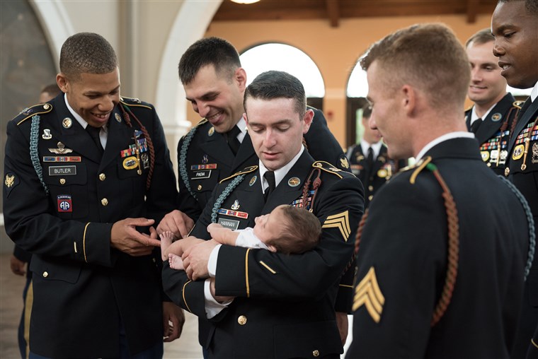  soldiers who served alongside Chris Harris delighted in meeting his baby girl together. 