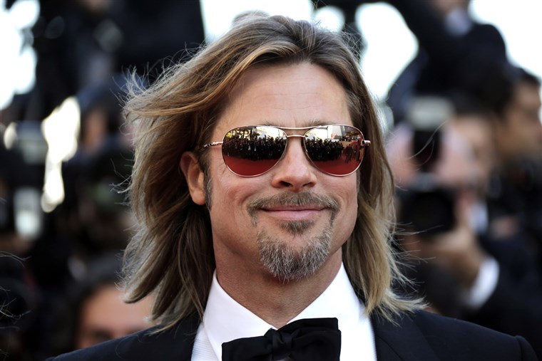देना member Brad Pitt poses on the red carpet ahead of the screening of the film 