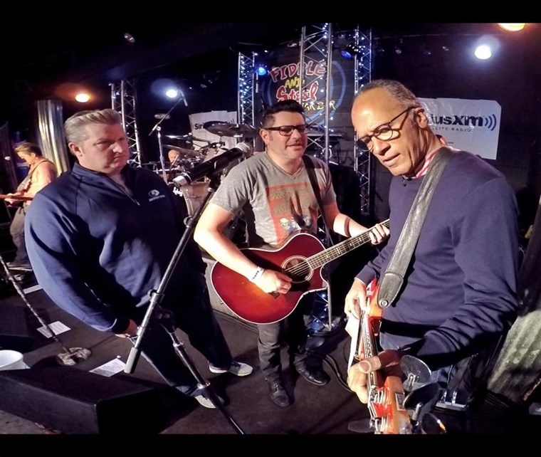 MA's Lester Holt plays bass at The Rascal Flatts' performance at the Fiddle and Steel Guitar Bar in Nashville.