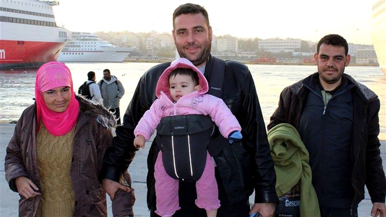  Syrian family arriving from the Greek islands. Their baby doesn't have socks on. With the winter coming and the refugees only at the beginning of their journeys, frostbite on hands and feet is a big concern for them. Most of their socks are constantly wet which exacerbates the problem.
