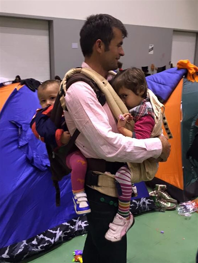  Afghan father in a refugee camp outside of Athens asked Carry the Future reps to teach him how to wear both of his small children.