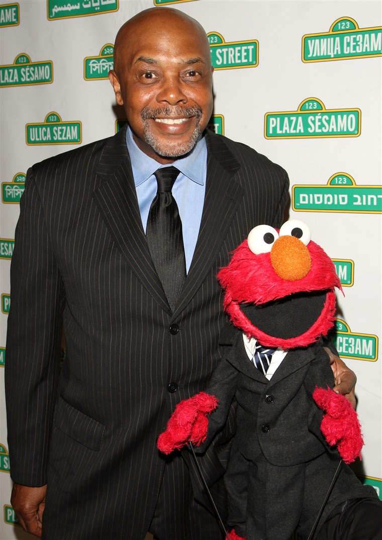Roscoe Orman poses with Elmo