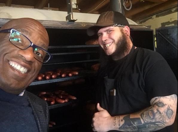 अल Roker takes a tour at Franklin Barbecue.