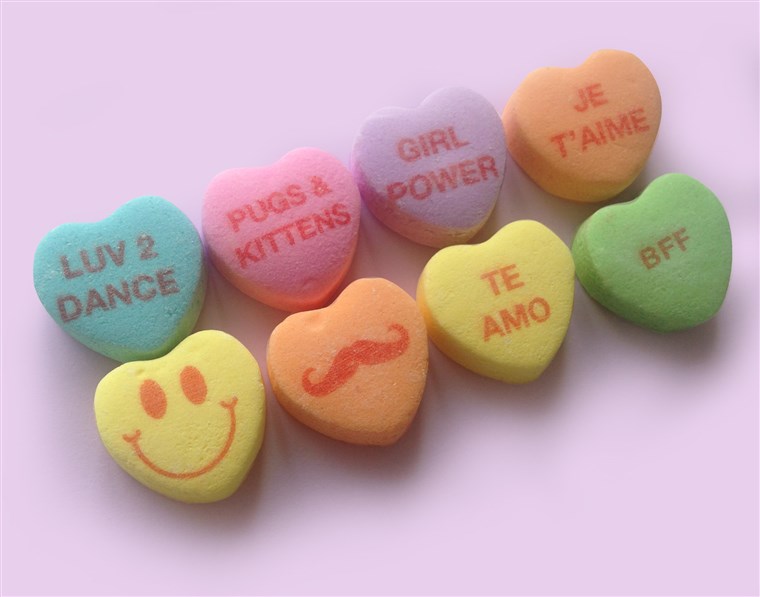 इस year's new candy hearts by NECCO feature some popular phrases.