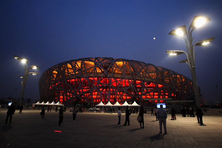 PEKING - DECEMBER 10: Crowds of tourists visit the National Stadium, known as the 