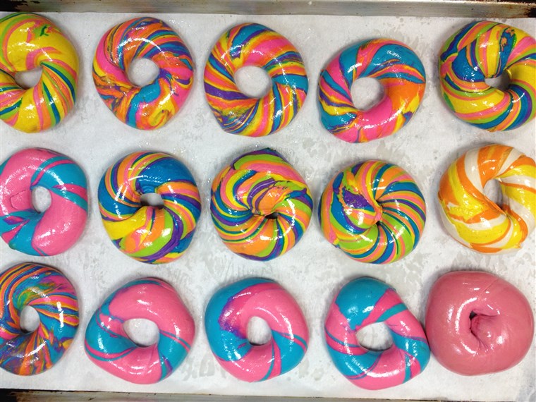 Fajta of Rainbow and Psychadelic Rainbow Bagels from Brooklyn's The Bagel Store